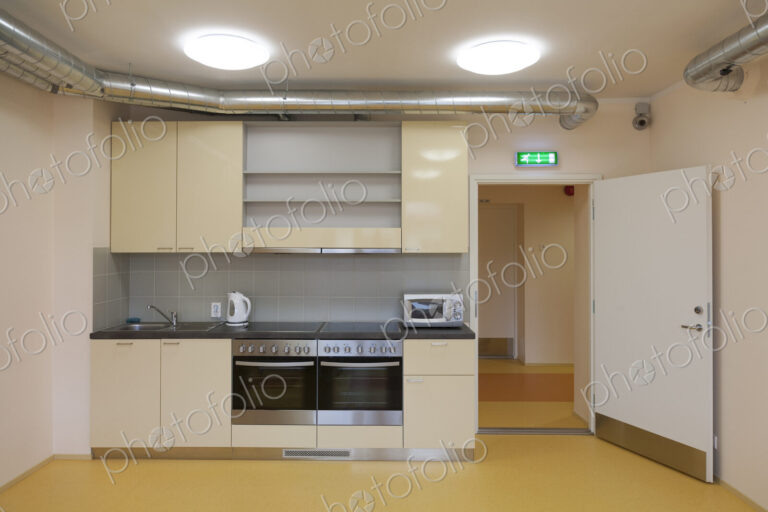 Modern youth hostel building. Kitchen with two ovens,kettle and toaster.