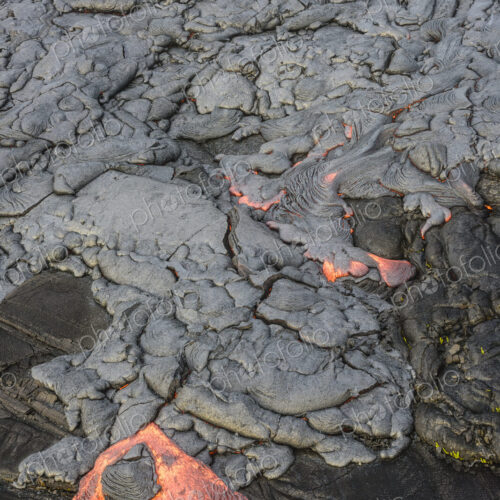 Molten lava glowing near dried lava Molten lava glowing near dried lava