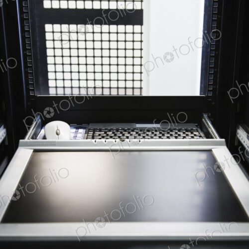Monitor in the interior of a rack in a computer server farm. Monitor in the interior of a rack in a computer server farm.