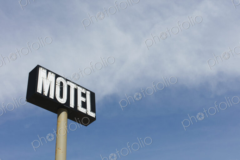 Motel sign against blue sky, near Maple Creek, Saskatchewan, Canada.