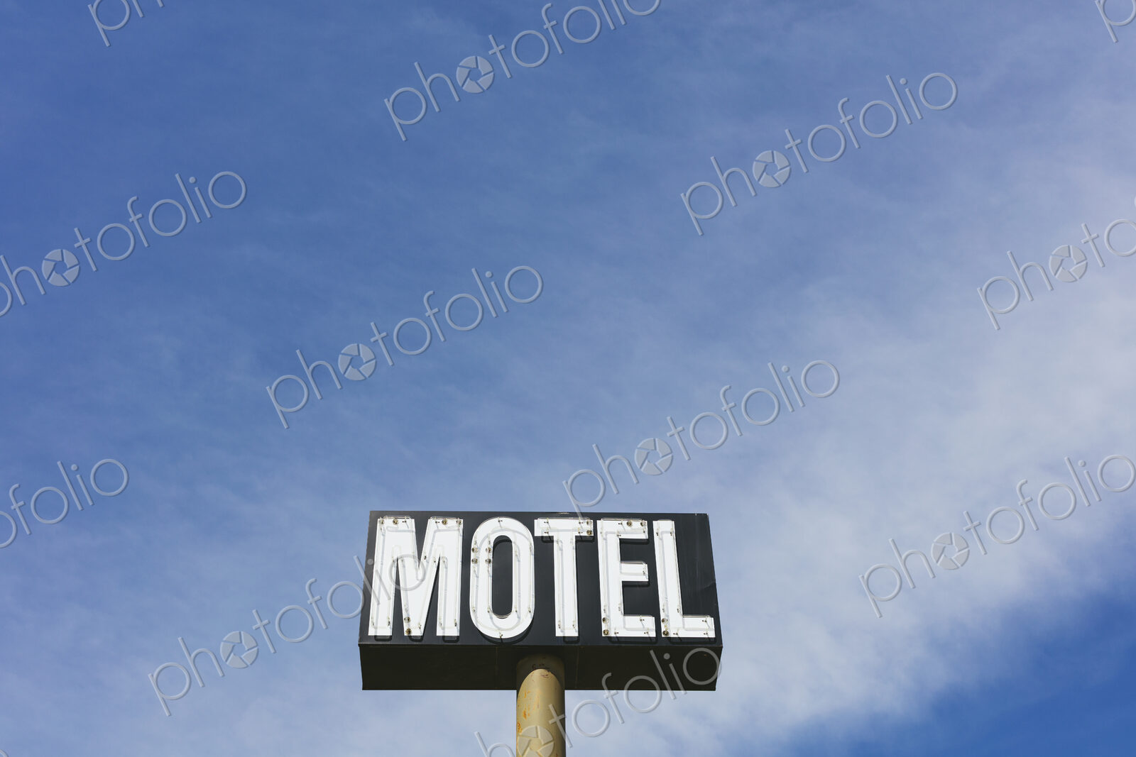 Motel sign against blue sky, near Maple Creek, Saskatchewan, Canada.