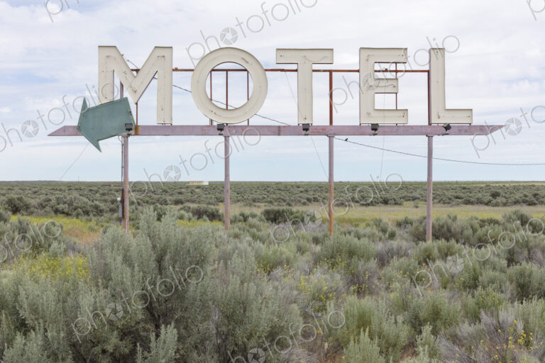 Motel sign in field of sage brush, near Waterville, Washington, USA.
