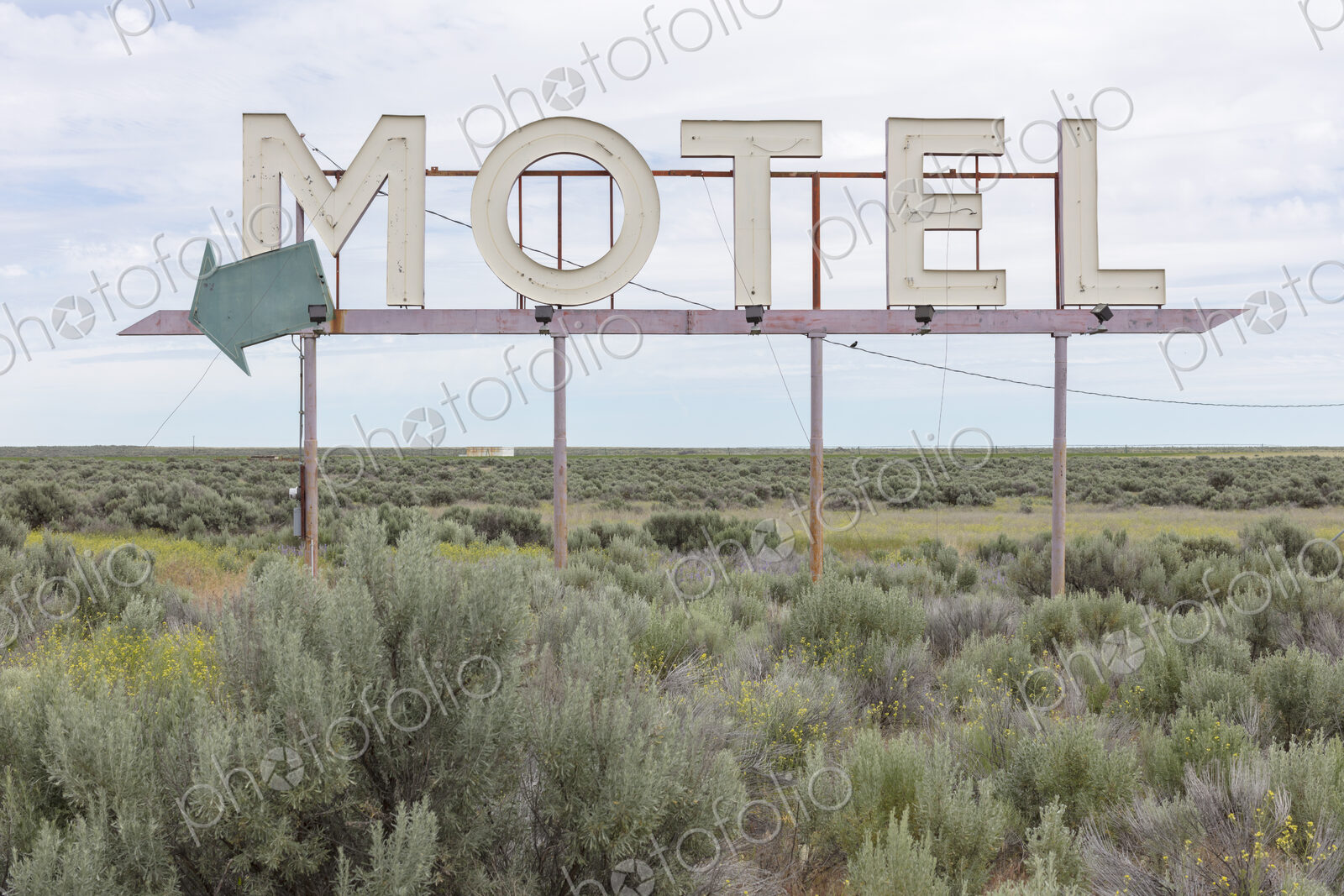 Motel sign in field of sage brush, near Waterville, Washington, USA.