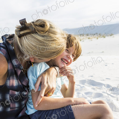Mother and her 6 year old son embracing, White Sands Nat'l Monument, NM Mother and her 6 year old son embracing, White Sands Nat'l Monument, NM