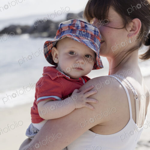 Mother holding her baby son.