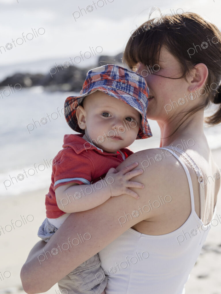 Mother holding her baby son.