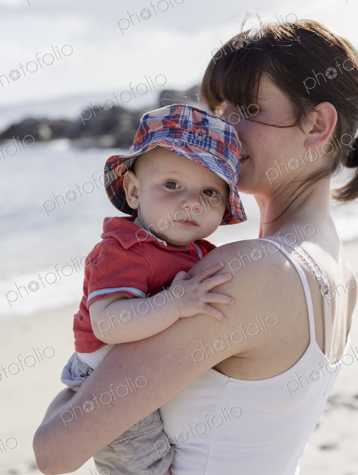 Mother holding her baby son.