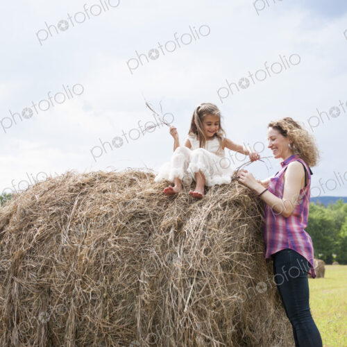 Mother playing outdoors with her daughter. Mother playing outdoors with her daughter.
