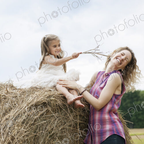 Mother playing outdoors with her daughter. Mother playing outdoors with her daughter.