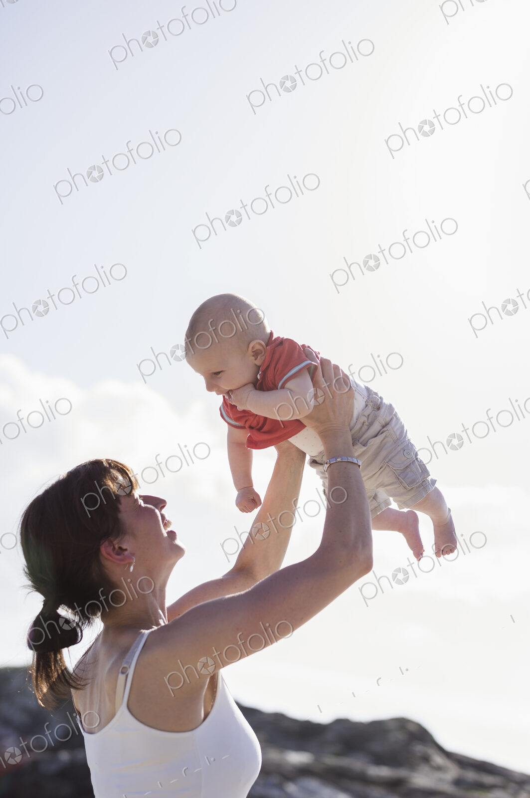 Mother playing with her baby boy.