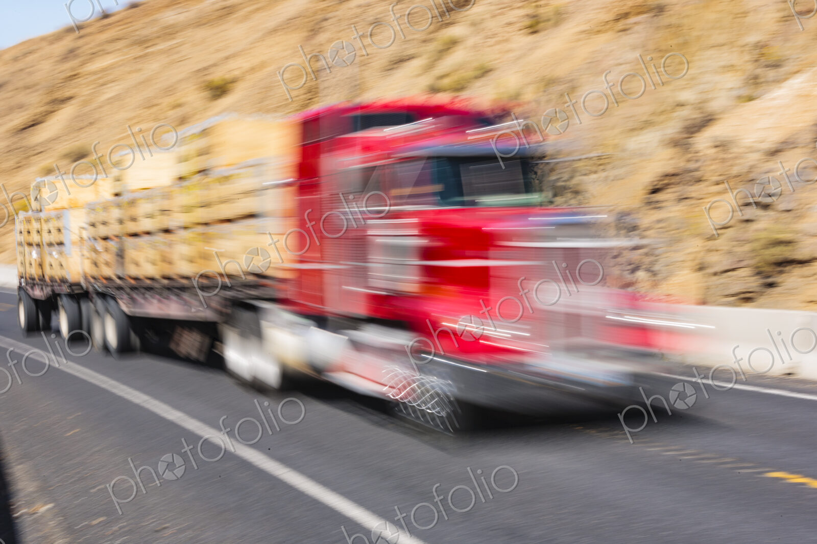 Motion blurred semi-truck on two lane rural highway, Wa USA