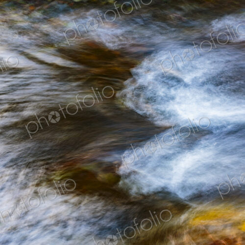 Motion blurred water flowing over stones in the Lyre River, Olympic Peninsula, Joyce,… Motion blurred water flowing over stones in the Lyre River, Olympic Peninsula, Joyce,…