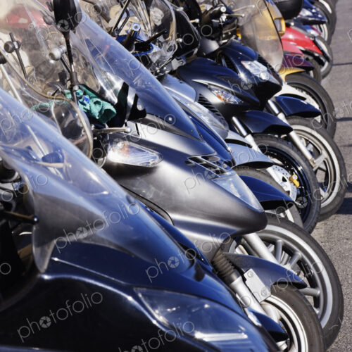 Motor Scooters Parked in Street Motor Scooters Parked in Street