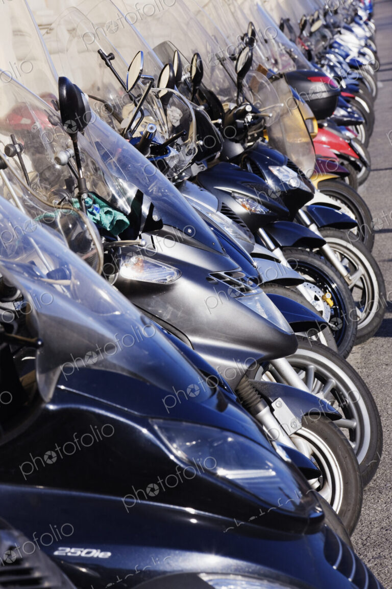 Motor Scooters Parked in Street