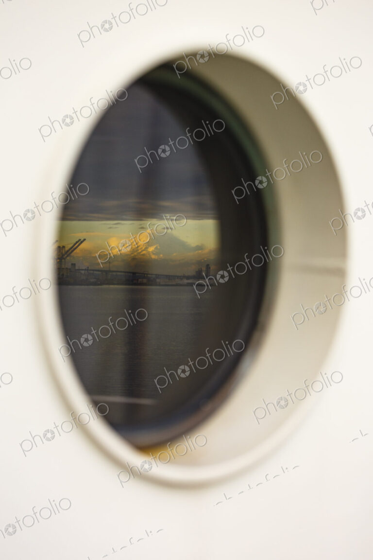 Mount Rainier and Seattle's harbor island viewed from a porthole on the Bainbridge…