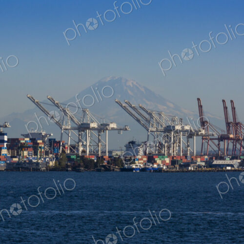 Mount Rainier seen through shipping cranes on the Seattle waterfront Mount Rainier seen through shipping cranes on the Seattle waterfront