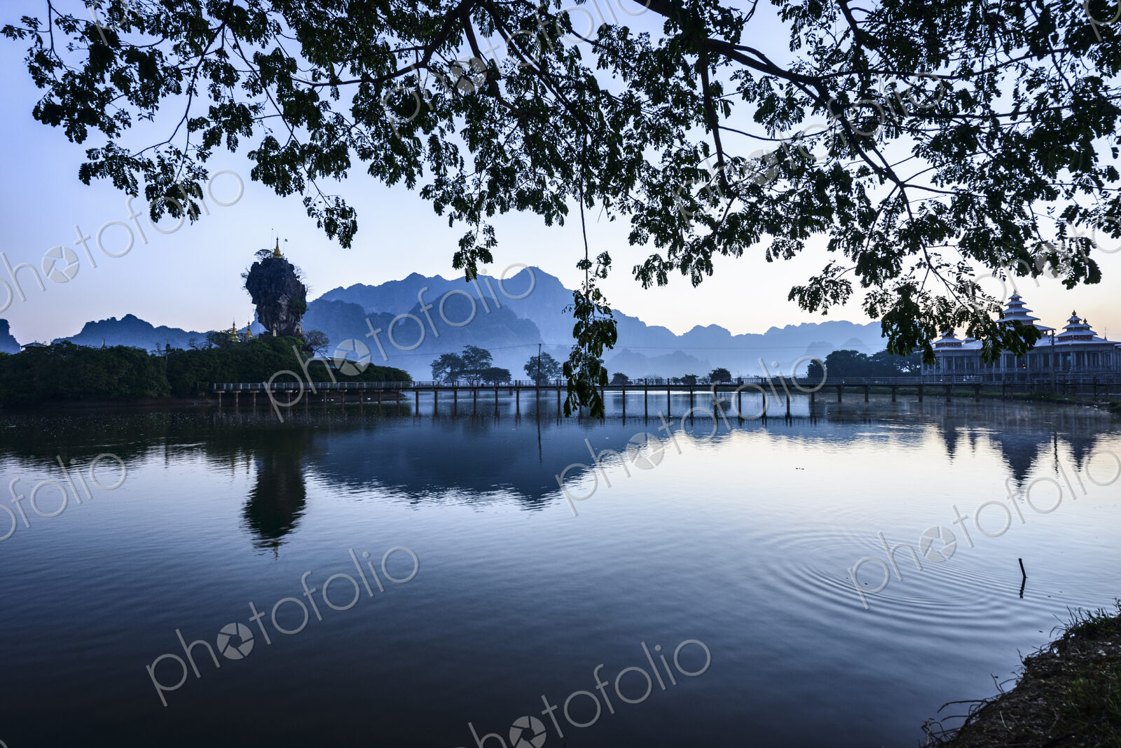 Mountains and the still waters of the Hpa An lake.