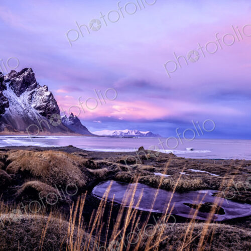Mountains over beach and remote fields Mountains over beach and remote fields