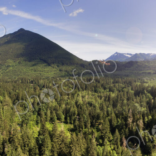 Moutain range and forests in the valley, elevated view of a majestic landscape and a… Moutain range and forests in the valley, elevated view of a majestic landscape and a…