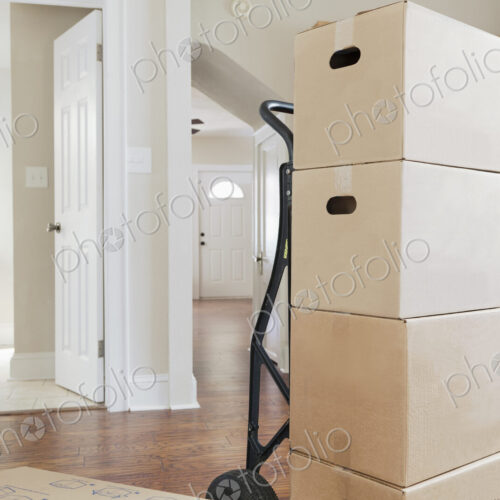 Moving house, relocation, cardboard boxes piled up in a house Moving house, relocation, cardboard boxes piled up in a house