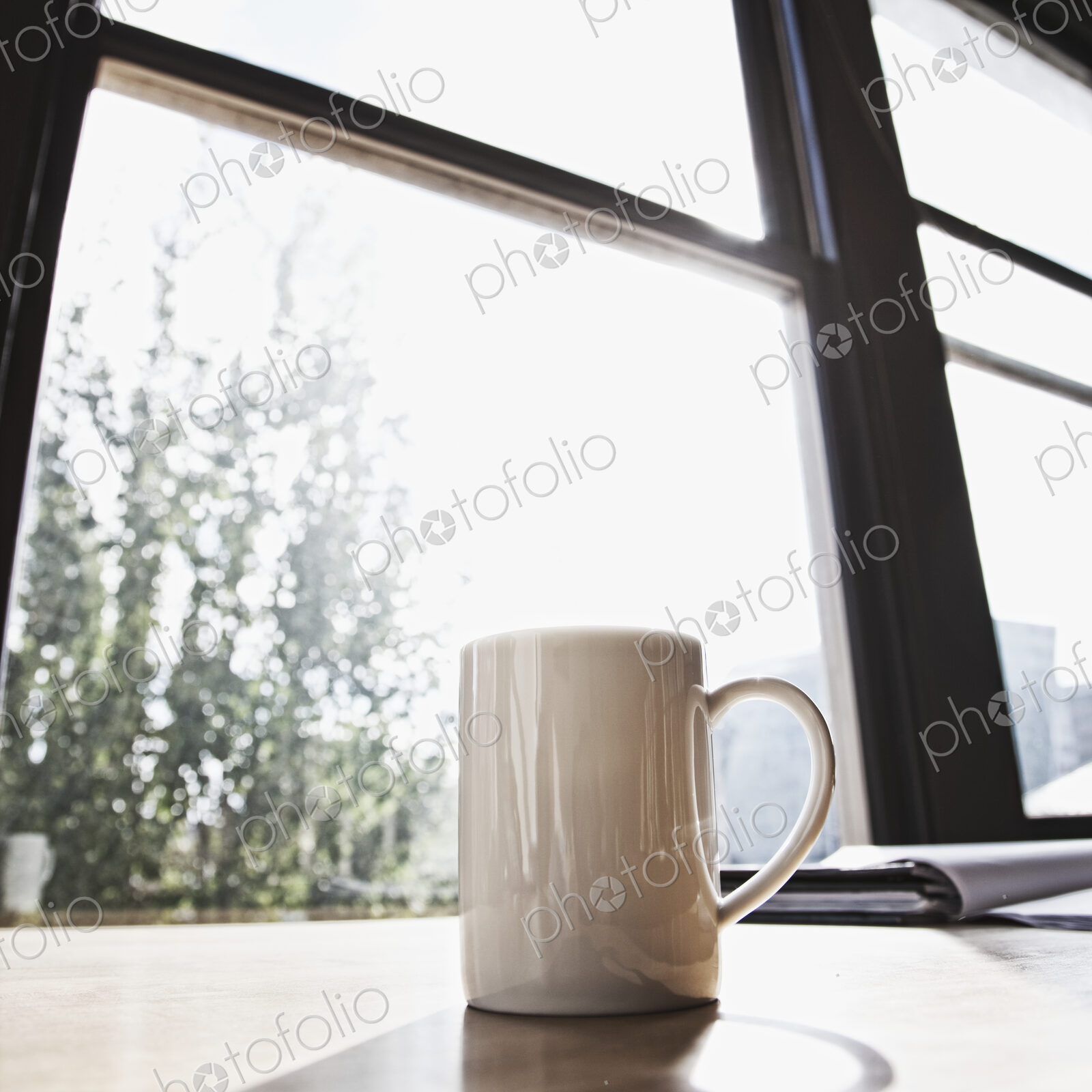 Mug on desk in urban office.