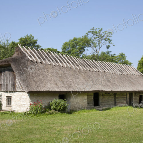 Muhu Museum Exterior in Estonia, a barn with a thatched roof.