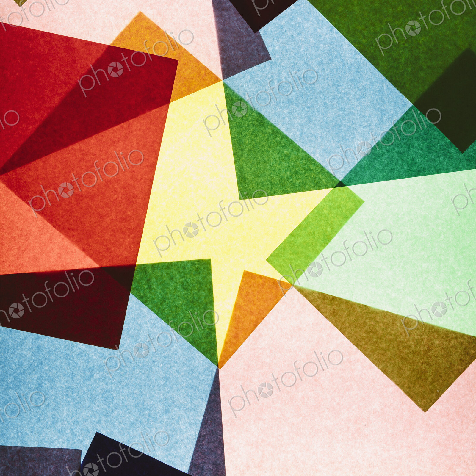 Multi-colored pieces of recycled construction paper. Shapes, triangles and different…