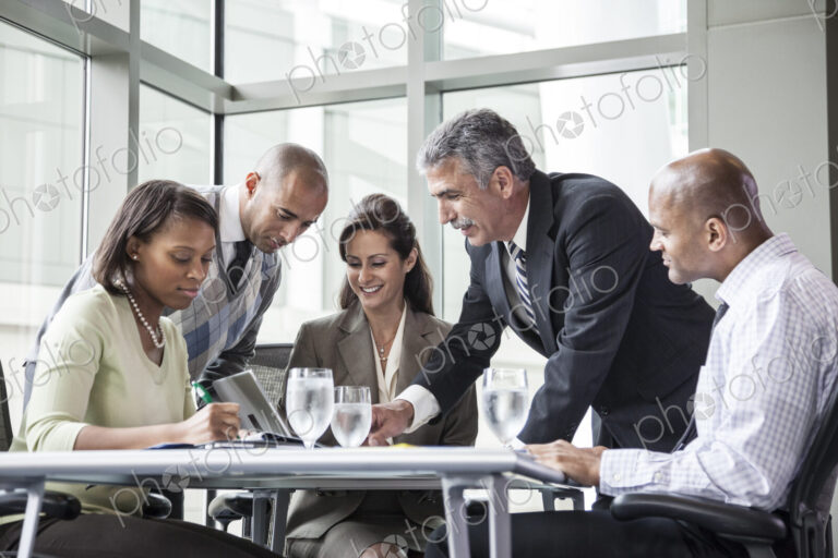 Multi-ethnic group of business people in a meeting at a conference table
