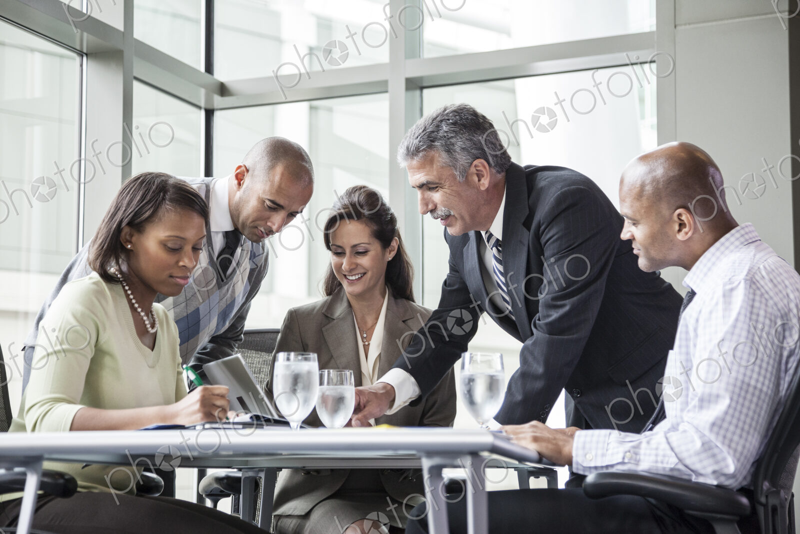 Multi-ethnic group of business people in a meeting at a conference table