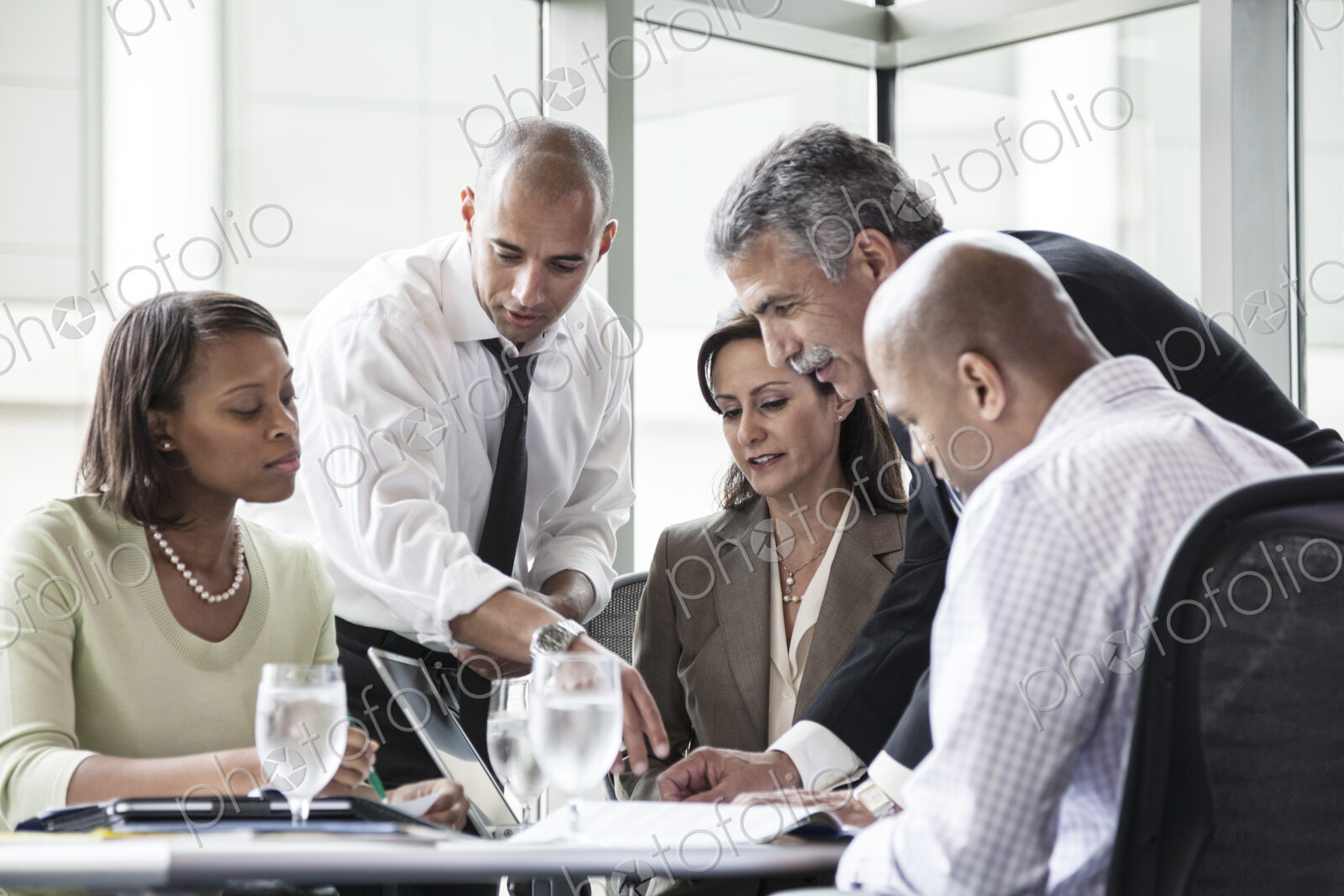 Multi-ethnic group of business people in a meeting at a conference table