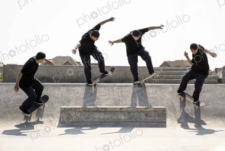 Multiple exposure of Caucasian man riding skateboard in skate park