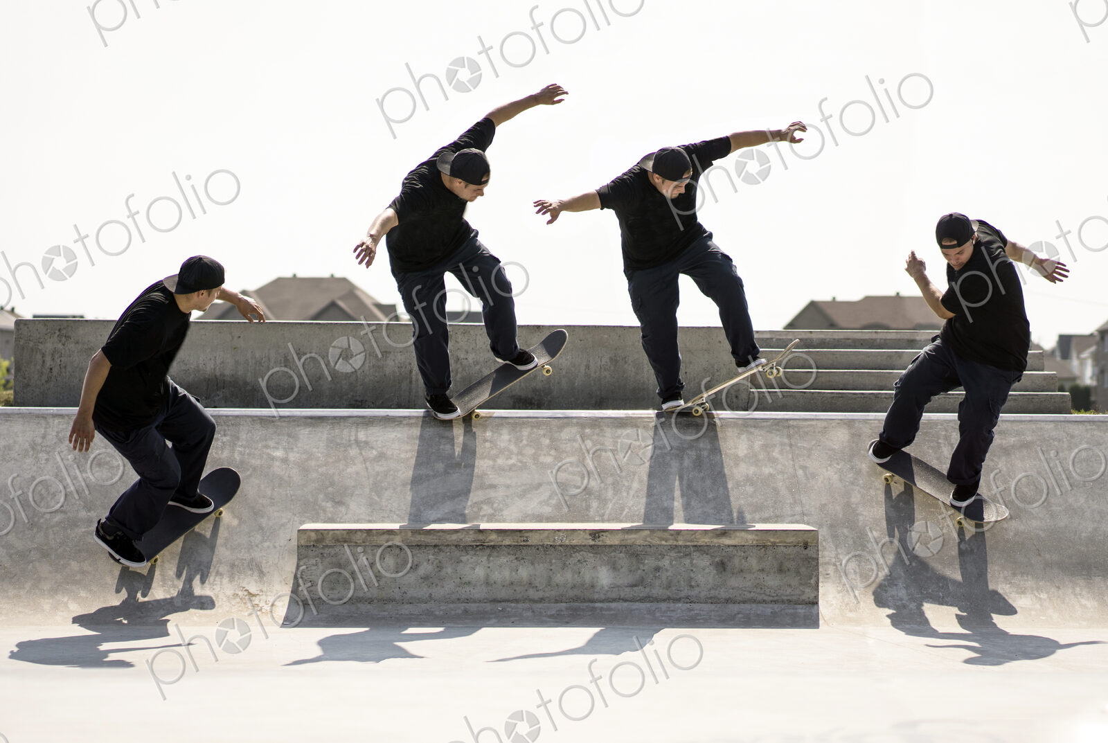 Multiple exposure of Caucasian man riding skateboard in skate park