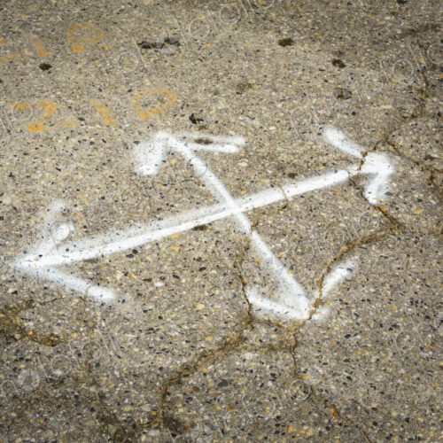 Multl-direction chalk arrows on pavement, cracks in the surface, potholes and concrete… Multl-direction chalk arrows on pavement, cracks in the surface, potholes and concrete…