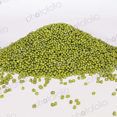 Mung beans, also known as green gram or golden gram, native to India. Heaped on a…
