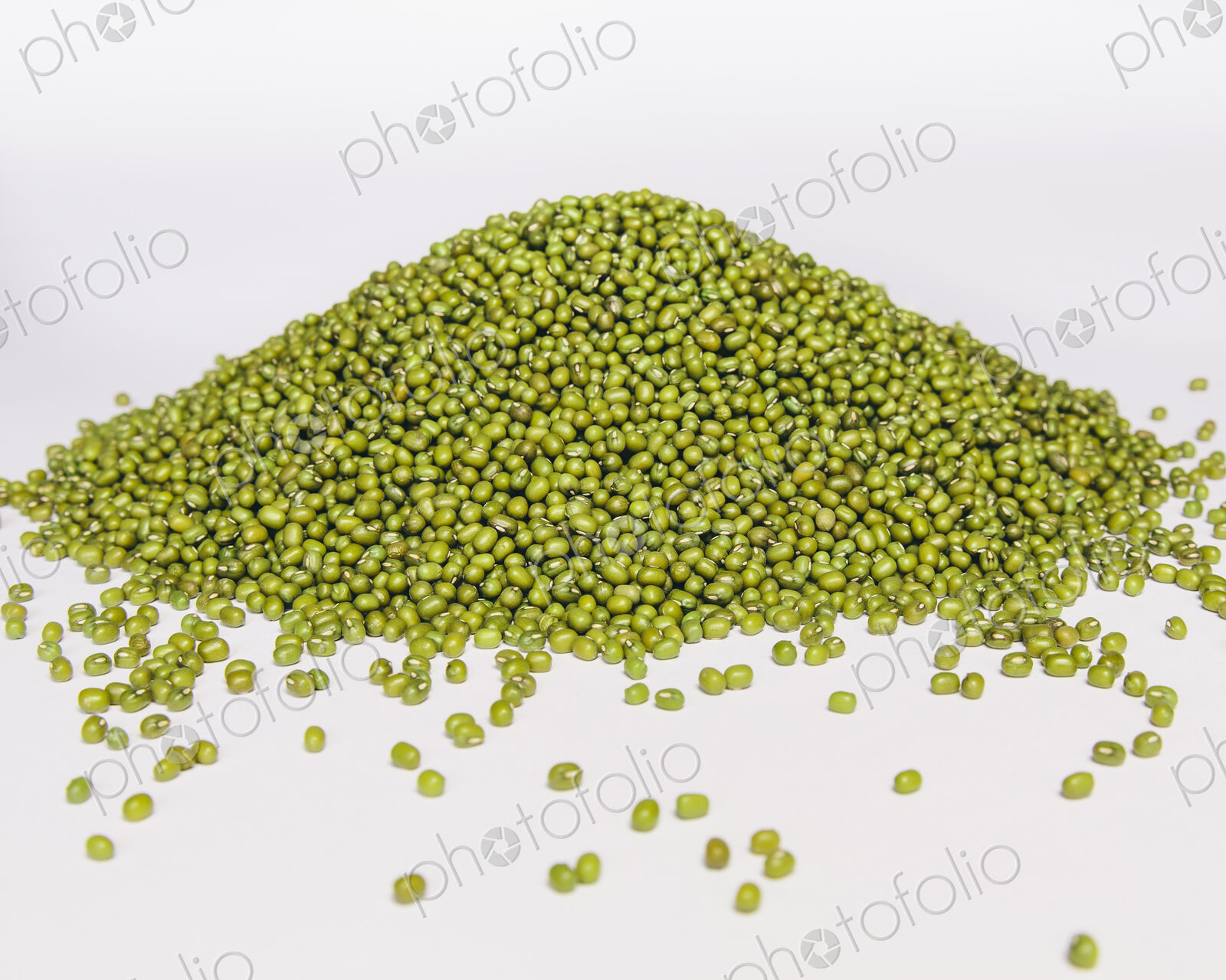 Mung beans, also known as green gram or golden gram, native to India. Heaped on a…