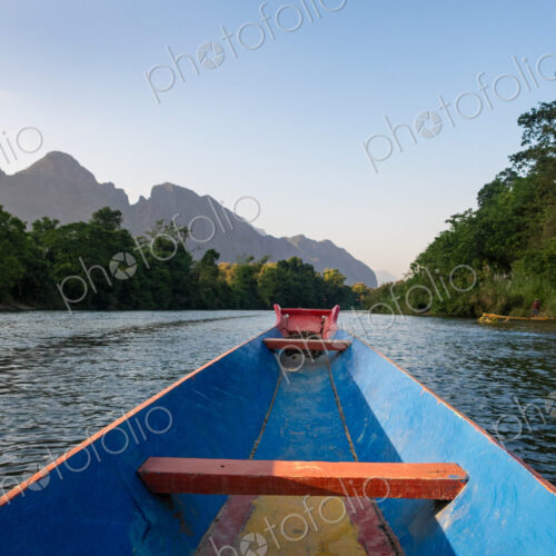 Nam Song River, a boat on the water at Vang Vieng, Laos