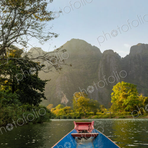 Nam Song River, a boat on the water at Vang Vieng, Laos