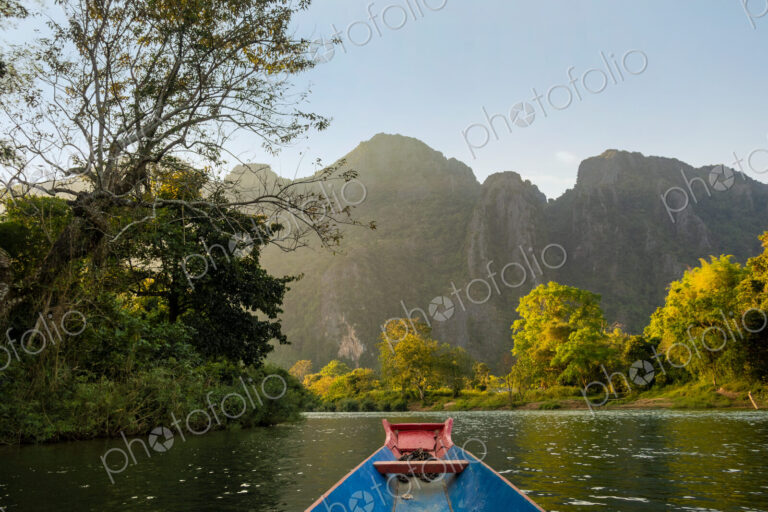Nam Song River, a boat on the water at Vang Vieng, Laos