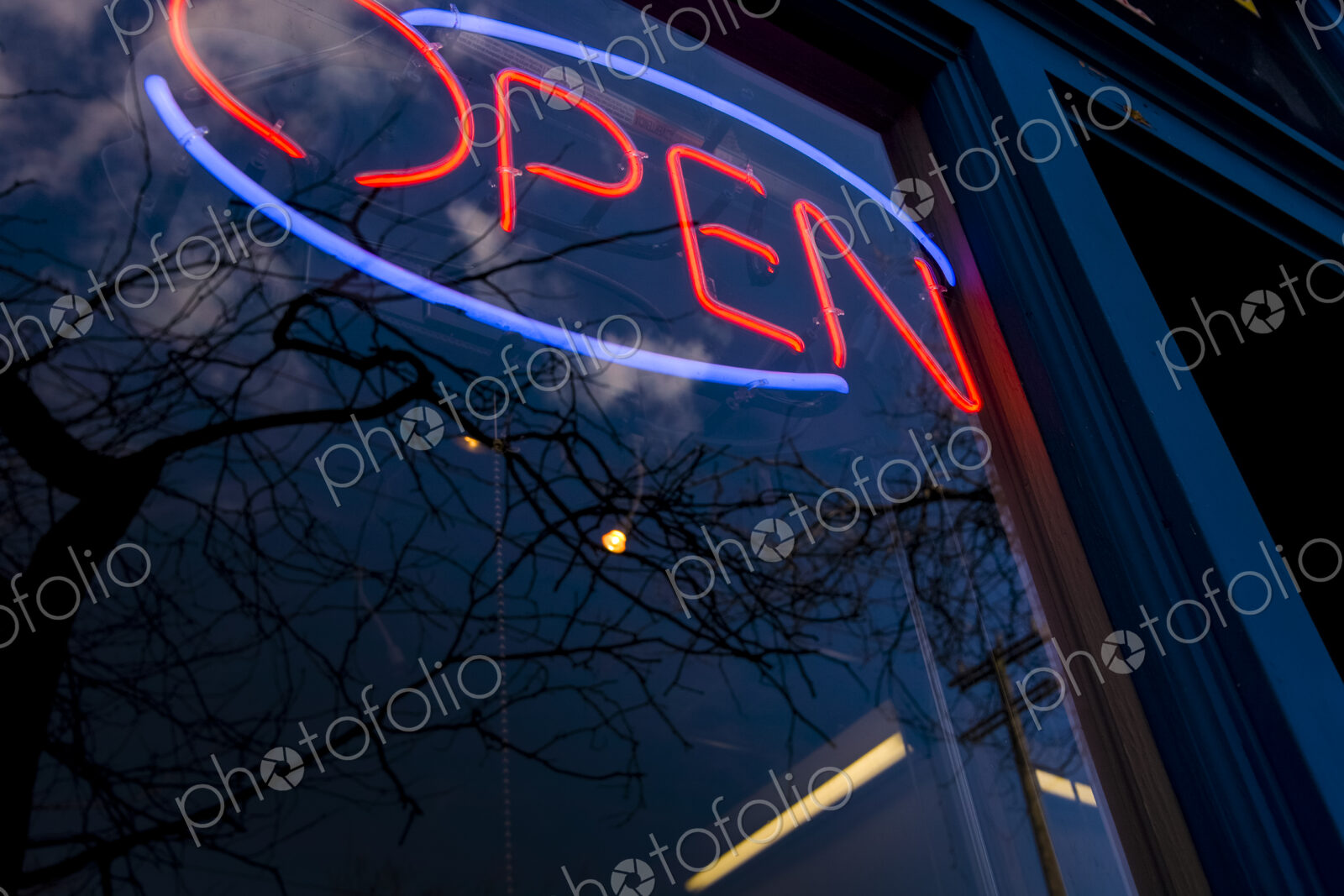 Neon Open sign in window of business and reflections in the glass, Seattle, WA, USA