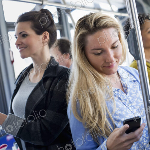 New York City park. People, men and women on a city bus. Public transport. Keeping in…