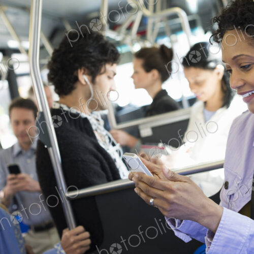 New York City park. People, men and women on a city bus. Public transport. Keeping in…