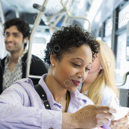 New York City park. People, men and women on a city bus. Public transport. Keeping in…