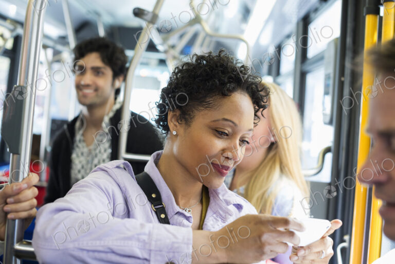 New York City park. People, men and women on a city bus. Public transport. Keeping in…