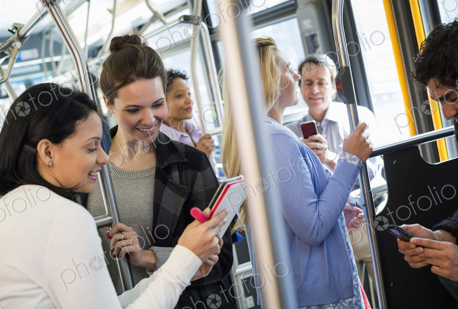 New York City park. People, men and women on a city bus. Public transport. Two women…