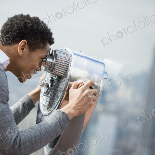 New York City. An observation deck overlooking the Empire State Building. A young man… New York City. An observation deck overlooking the Empire State Building. A young man…