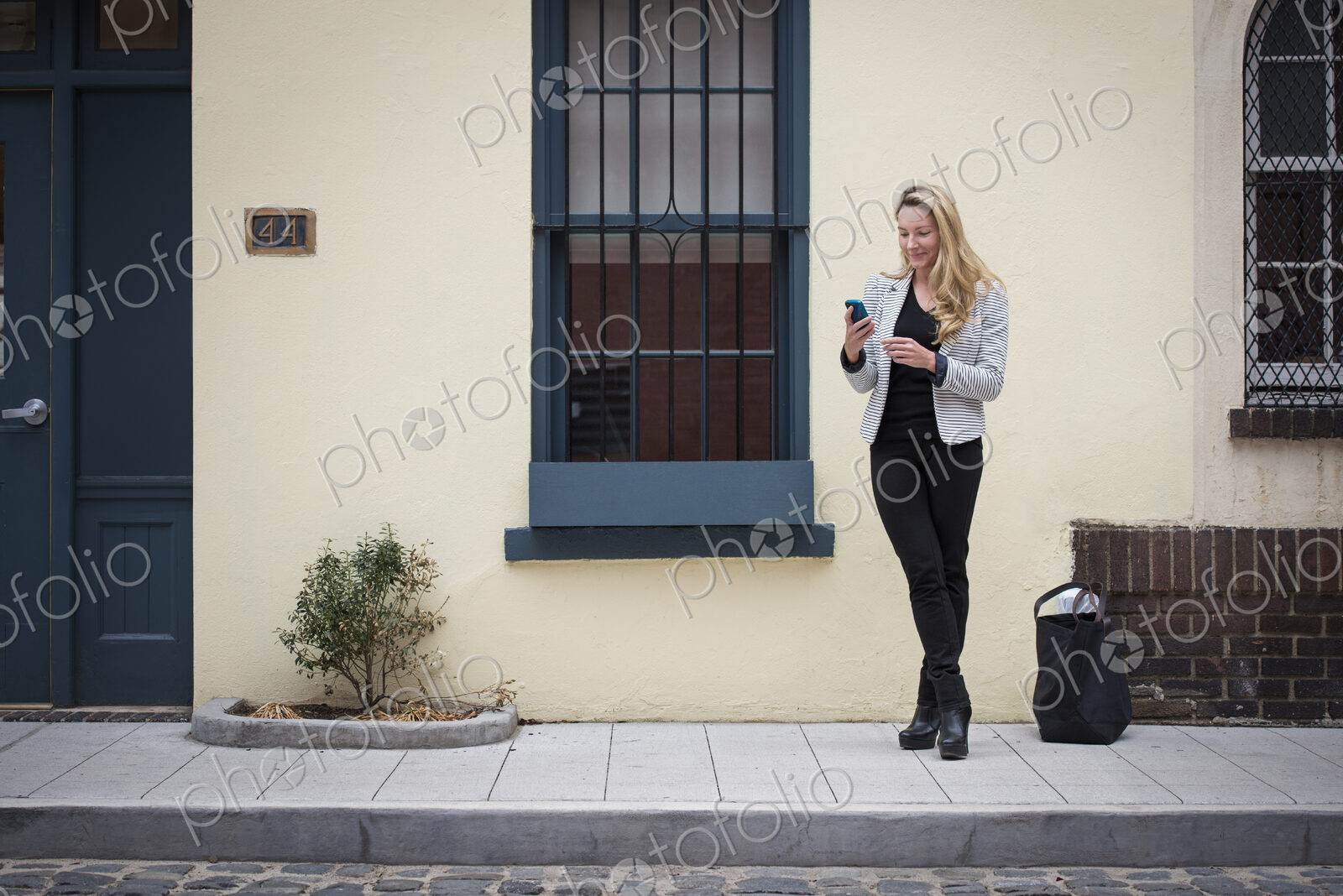 New York city street life.Young people outdoors on the city streets in springtime. A…