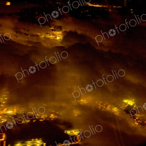 Night aerial view of Illuminated urban areas of a city. Night aerial view of Illuminated urban areas of a city.