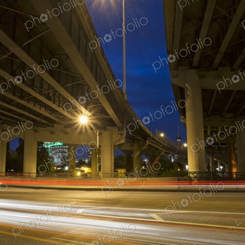 Night view of Interstate 5 freeway overpass in Portland, Oregon with glowing… Night view of Interstate 5 freeway overpass in Portland, Oregon with glowing…