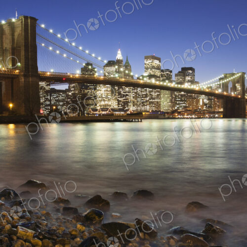 Night view towards Manhattan from Brooklyn, with the Brooklyn Bridge spanning the East… Night view towards Manhattan from Brooklyn, with the Brooklyn Bridge spanning the East…