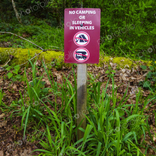 No camping or sleeping in vehicles sign in outdoor area, Port Angeles, WA USA
